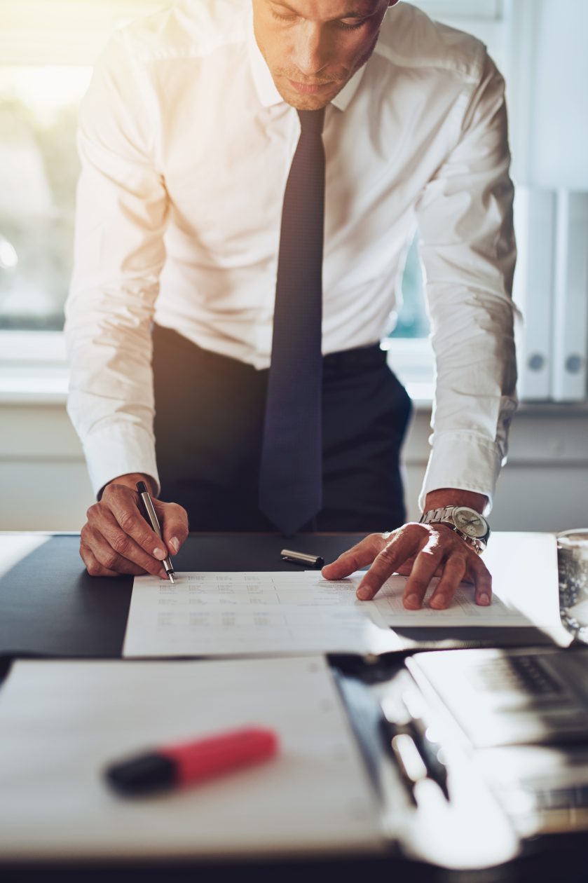 Business man closing a deal signing documents
